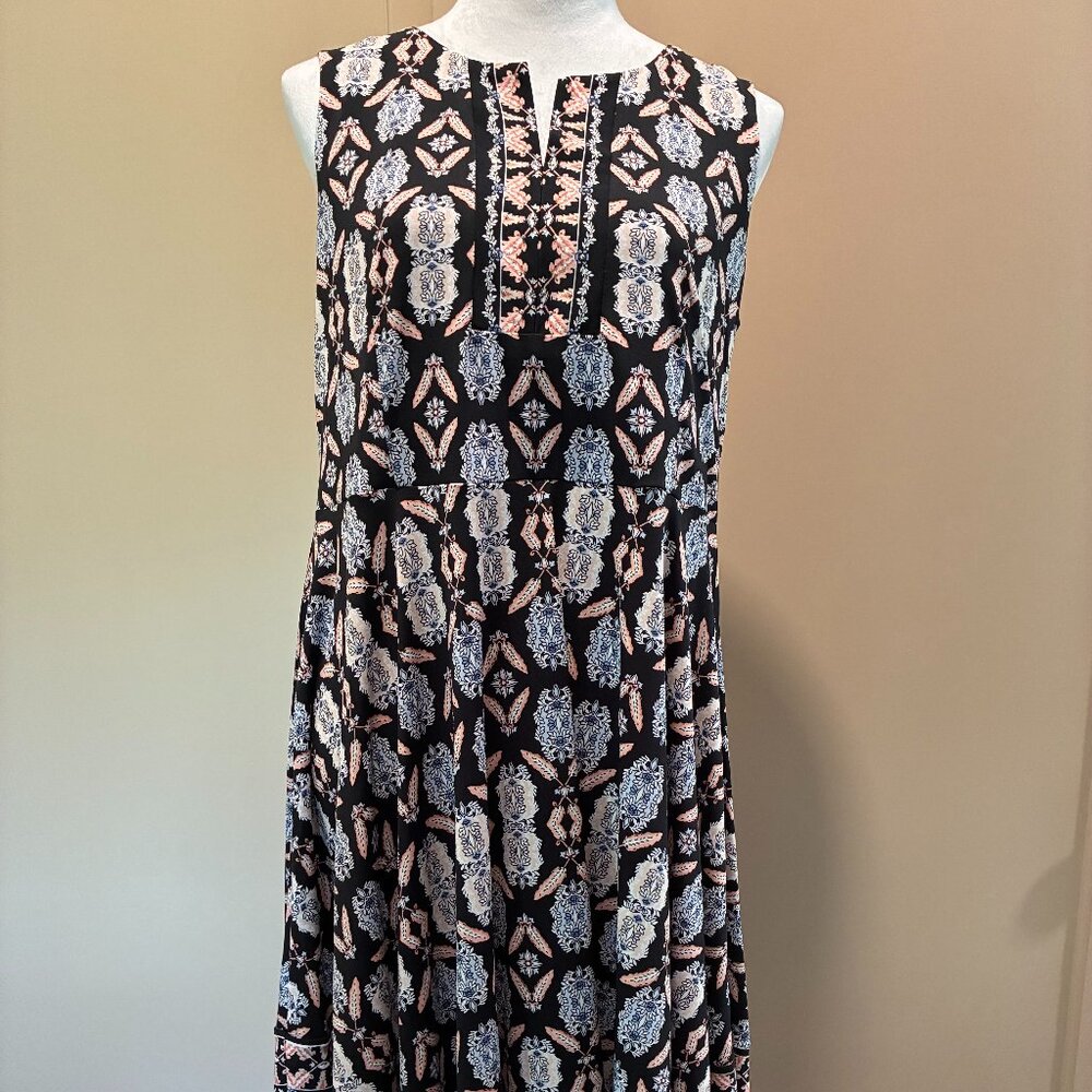 Dark background with bright, varied patterns create a dramatic evening style.